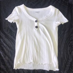 White top with brown buttons